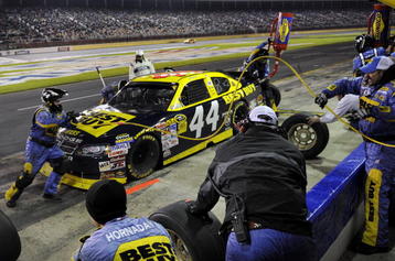 CONCORD, NC - OCTOBER 17:  AJ Allmendinger, driver of the #44 Best Buy Dodge, makes a pit stop during the NASCAR Sprint Cup Series NASCAR Banking 500 at Lowe's Motor Speedway on October 17, 2009 in Concord, North Carolina.  (Photo by John Harrelson/Getty Images for NASCAR)