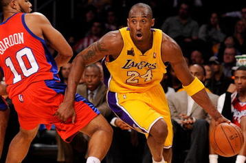LOS ANGELES, CA - OCTOBER 27:  Kobe Bryant #24 of the Los Angeles Lakers drives to the basket against Eric Gordon #10 of the Los Angeles Clippers during the season opening game at Staples Center on October 27, 2009 in Los Angeles, California.  The Lakers won 99-92.  NOTE TO USER: User expressly acknowledges and agrees that, by downloading and or using this photograph, User is consenting to the terms and conditions of the Getty Images License Agreement. Mandatory Copyright Notice: Copyright 2009 NBAE  (Photo by Kevork Djansezian/Getty Images)