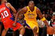 LOS ANGELES, CA - OCTOBER 27:  Kobe Bryant #24 of the Los Angeles Lakers drives to the basket against Eric Gordon #10 of the Los Angeles Clippers during the season opening game at Staples Center on October 27, 2009 in Los Angeles, California.  The Lakers won 99-92.  NOTE TO USER: User expressly acknowledges and agrees that, by downloading and or using this photograph, User is consenting to the terms and conditions of the Getty Images License Agreement. Mandatory Copyright Notice: Copyright 2009 NBAE  (Photo by Kevork Djansezian/Getty Images)