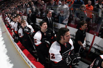 PHILADELPHIA - MARCH 5: Head coach John Stevens and the Philadelphia Flyers stand at attention during the national anthem at the Wachovia Center March 5, 2009 in Philadelphia, Pennsylvania. The Flames defeated the Flyers 5-1. (Photo by Bruce Bennett/Getty Images)