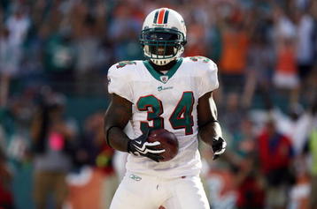 MIAMI - OCTOBER 25:  Running back Ricky Williams #34 of the Miami Dolphins celebrates a touchdown run against the New Orleans Saints at Land Shark Stadium on October 25, 2009 in Miami, Florida.  (Photo by Doug Benc/Getty Images)