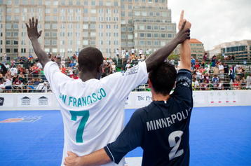 WASHINGTON - AUGUST 02:  Mouhamed Diaw, #7 of San Francisco (L) and Alvin Soto, #2 of Minneapolis, celebrate the conclusion of the final match, which was won by San Francisco, at the Street Soccer USA Cup tournament on August 2, 2009 in Washington, DC. Players from homeless shelters in sixteen cities competed for the national title and a spot on the US World Cup Team, which will compete in the Homeless World Cup tournament in Milan, Italy, in September. (Photo by Brendan Hoffman/Getty Images)