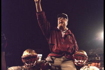 1 Jan 1996:  Head coach Bobby Bowden of the Florida State Seminoles is carried triumphantly off the field by nose guard Andre Wadsworth #8 and tackle Orpheus Roy after defeating the Notre Dame Fighting Irish in the Orange Bowl in Miami, Florida 31-26.  Ma