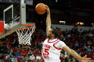 LAS VEGAS - MARCH 12:  Carlon Brown #15 of the Utah Utes is fouled by Ronnie Moss #5 of the Texas Christian University Horned Frogs as he tries to dunk during a quarterfinal game of the Conoco Mountain West Conference Basketball Championships at the Thomas & Mack Center March 12, 2009 in Las Vegas, Nevada. The Utes won 61-58.  (Photo by Ethan Miller/Getty Images)