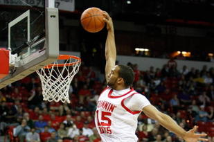 LAS VEGAS - MARCH 12:  Carlon Brown #15 of the Utah Utes is fouled by Ronnie Moss #5 of the Texas Christian University Horned Frogs as he tries to dunk during a quarterfinal game of the Conoco Mountain West Conference Basketball Championships at the Thomas & Mack Center March 12, 2009 in Las Vegas, Nevada. The Utes won 61-58.  (Photo by Ethan Miller/Getty Images)