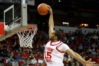LAS VEGAS - MARCH 12:  Carlon Brown #15 of the Utah Utes is fouled by Ronnie Moss #5 of the Texas Christian University Horned Frogs as he tries to dunk during a quarterfinal game of the Conoco Mountain West Conference Basketball Championships at the Thomas & Mack Center March 12, 2009 in Las Vegas, Nevada. The Utes won 61-58.  (Photo by Ethan Miller/Getty Images)