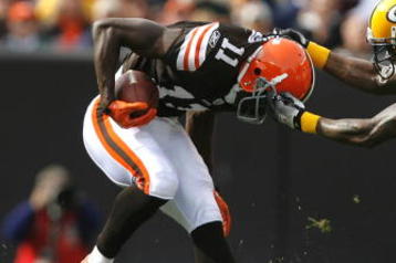 CLEVELAND, OH - OCTOBER 25:  Al Harris #31 of the Green Bay Packers tackles Mohamed Massaquoi #11 of the Cleveland Browns at Cleveland Browns Stadium on October 25, 2009 in Cleveland, Ohio.  (Photo by Matt Sullivan/Getty Images)