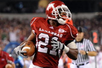 ARLINGTON, TX - OCTOBER 03:  Running back Michael Smith #21 of the Arkansas Razorbacks scores a touchdown against the Texas A&M Aggies at Dallas Cowboys Stadium on October 3, 2009 in Arlington, Texas.  (Photo by Ronald Martinez/Getty Images)