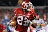 ARLINGTON, TX - OCTOBER 03:  Running back Michael Smith #21 of the Arkansas Razorbacks scores a touchdown against the Texas A&M Aggies at Dallas Cowboys Stadium on October 3, 2009 in Arlington, Texas.  (Photo by Ronald Martinez/Getty Images)