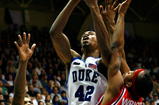 DURHAM, NC - FEBRUARY 23:  Lance Thomas #42 of the Duke Blue Devils attacks the basket against Sean Evans #22 and Larry Wright #5 of the St. John's Red Storm during the second half at Cameron Indoor Stadium February 23, 2008 in Durham, North Carolina. Duke defeated St. John's 86-56.  (Photo by Kevin C. Cox/Getty Images)