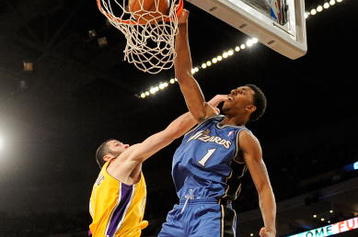 LOS ANGELES, CA - JANUARY 22:  Nick Young #1 of the Washington Wizards dunks against Vladimir Radmanovic #10 of the Los Angeles Lakers during the fourth quarter at the Staples Center January 22, 2009 in Los Angeles, California. NOTE TO USER: User expressly acknowledges and agrees that, by downloading and/or using this Photograph, user is consenting to the terms and conditions of the Getty Images License Agreement.  (Photo by Kevork Djansezian/Getty Images)