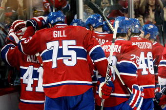 MONTREAL- OCTOBER 24: Members of the Montreal Canadiens celebrate the ovetime goal from team mate Mike Cammalleri #13 during the NHL game against the New York Rangers on October 24, 2009 at the Bell Centre in Montreal, Quebec, Canada. (Photo by Richard Wolowicz/Getty Images)