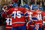 MONTREAL- OCTOBER 24: Members of the Montreal Canadiens celebrate the ovetime goal from team mate Mike Cammalleri #13 during the NHL game against the New York Rangers on October 24, 2009 at the Bell Centre in Montreal, Quebec, Canada. (Photo by Richard Wolowicz/Getty Images)