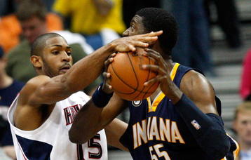 ATLANTA - OCTOBER 28:  Al Horford #15 of the Atlanta Hawks strips the ball from Roy Hibbert #55 of the Indiana Pacers at Philips Arena on October 28, 2009 in Atlanta, Georgia.  (Photo by Kevin C. Cox/Getty Images)