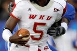 LEXINGTON, KY - SEPTEMBER 27:  Quarterback K.J. Black #5 of the Western Kentucky Hilltoppers looks to make a play with the ball against the Kentucky Wildcats during the game at Commonwealth Stadium on September 27, 2008 in Lexington, Kentucky. The Wildcats defeated the Hilltoppers 41-3.  (Photo by Andy Lyons/Getty Images)