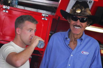 AVONDALE, AZ - APRIL 17:  AJ Allmendinger (L), driver of the #44 Charter Dodge, talks with team owner Richard Petty (R) during practice for the NASCAR Sprint Cup Series SUBWAY Fresh Fit 500 at Phoenix International Raceway on April 17, 2009 in Avondale, AZ.  (Photo by Todd Warshaw/Getty Images)