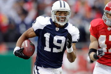KANSAS CITY, MO - OCTOBER 11:  Miles Austin #19 of the Dallas Cowboys runs with the ball for yardage during the NFL game against the Kansas City Chiefs at Arrowhead Stadiumin on October 11, 2009 Kansas City, Missouri. The Cowboys defeated the Chiefs 26-20 in overtime. (Photo by Jamie Squire/Getty Images)