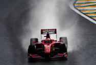 SAO PAULO, BRAZIL - OCTOBER 17:  Kimi Raikkonen of Finland and Ferrari drives during qualifying for the Brazilian Formula One Grand Prix at the Interlagos Circuit on October 17, 2009 in Sao Paulo, Brazil.  (Photo by Clive Mason/Getty Images)
