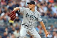 NEW YORK - JULY 01:  Jarrod Washburn #56 of the Seattle Mariners pitches against the New York Yankees on July 1, 2009 at Yankee Stadium in the Bronx borough of New York City.  (Photo by Jim McIsaac/Getty Images)