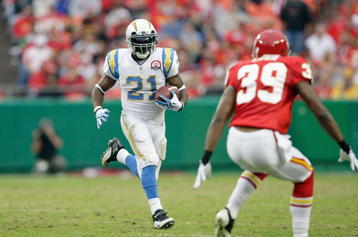 KANSAS CITY, MO - OCTOBER 25:  LaDainian Tomlinson #21 of the San Diego Chargers carries the ball against Brandon Carr #39 of the Kansas City Chiefs on October 25, 2009 at Arrowhead Stadium in Kansas City, Missouri. (Photo by Jamie Squire/Getty Images)