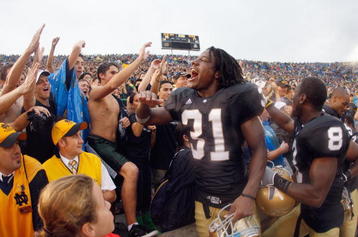 SOUTH BEND, IN - SEPTEMBER 13: Sergio Brown #31 of the Notre Dame Fighting Irish celebrates with fans after a 35-17 victory over the Michigan Wolverines on September 13, 2008 at Notre Dame Stadium in South Bend, Indiana. (Photo by Gregory Shamus/Getty Images)