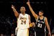 LOS ANGELES, CA - JANUARY 25:  Tim Duncan #21 of the San Antonio Spurs reacts to a foul next to Kobe Bryant #24 of the Los Angeles Lakers during the forth quarter at the Staples Center on January 25, 2009 in Los Angeles, California.  The Lakers defeated the Spurs 99-85.  NOTE TO USER:  User expressly acknowledges and agrees that, by downloading and/or using this photograph, User is consenting to the terms and conditions of the Getty Images License Agreement.  (Photo by Harry How/Getty Images)