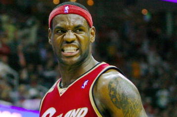 CLEVELAND - OCTOBER 27:  LeBron James #23 of the Cleveland Cavaliers reacts during the season opener against the Boston Celtics at Quicken Loans Arena on October 27, 2009 in Cleveland, Ohio.  NOTE TO USER: User expressly acknowledges and agrees that, by downloading and or using this photograph, User is consenting to the terms and conditions of the Getty Images License Agreement. (Photo by Gregory Shamus/Getty Images)