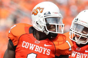 STILLWATER, OK - SEPTEMBER 5:  Wide receiver Dez Bryant #1 of the Oklahoma State Cowboys celebrates his touchdown with teammate Dexter Pratt #22 during the second quarter of the game against the Georgia Bulldogs at Boone Pickens Stadium on September 5, 2009 in Stillwater, Oklahoma. (Photo by Christian Petersen/Getty Images)