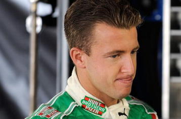MARTINSVILLE, VA - OCTOBER 23: AJ Allmendinger, driver of the #44 Coleman Natural Foods Dodge, looks on in the garage prior to practice for the NASCAR Sprint Cup Series TUMS Fast Relief 500 at Martinsville Speedway on October 23, 2009 in Martinsville, Virginia.  (Photo by Rusty Jarrett/Getty Images for NASCAR)