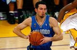 LOS ANGELES, CA - JUNE 07:  J.J. Redick #7 of the Orlando Magic moves the ball against Lamar Odom #7 of the Los Angeles Lakers in Game Two of the 2009 NBA Finals at Staples Center on June 7, 2009 in Los Angeles, California.  The Lakers won 101-96.  NOTE TO USER: User expressly acknowledges and agrees that, by downloading and or using this photograph, User is consenting to the terms and conditions of the Getty Images License Agreement.  (Photo by Jeff Gross/Getty Images)