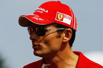 MONZA, ITALY - SEPTEMBER 13:  Giancarlo Fisichella of Italy and Ferrari attends the drivers parade during the Italian Formula One Grand Prix at the Autodromo Nazionale di Monza on September 13, 2009 in Monza, Italy.  (Photo by Clive Rose/Getty Images)