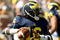 ANN ARBOR, MI - SEPTEMBER 19:  Quarterback Denard Robinson #16 of the Michigan Wolverines throws a pass against the Eastern Michigan Eagles at Michigan Stadium on September 19, 2009 in Ann Arbor, Michigan.  Michigan won 45-17.  (Photo by Stephen Dunn/Getty Images)