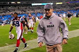 CHARLOTTE, NC - OCTOBER 25:  Coach Dick Jauron and Ashlee Palmer of the Buffalo Bills leave the field after a game against the Carolina Panthers at Bank of America Stadium on October 25, 2009 in Charlotte, North Carolina. Buffalo won 20-9. (Photo by Grant Halverson/Getty Images)