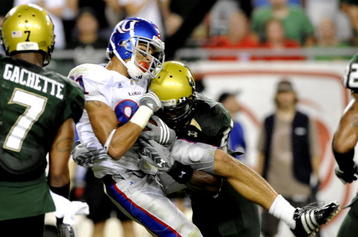 TAMPA, FL - SEPTEMBER 12: Wide receiver Jonathan Wilson  #81 of the Kansas University Jayhawks grabs a pass against the University of South Florida Bulls at Raymond James Stadium on September 12, 2008 in Tampa, Florida.  (Photo by Al Messerschmidt/Getty Images)