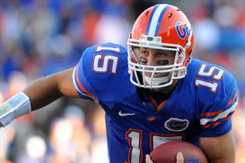 GAINESVILLE, FL - OCTOBER 17: Quarterback Tim Tebow #15 of the Florida Gators rushes upfield against the University of Arkansas Razorbacks October 17, 2009 at Ben Hill Griffin Stadium in Gainesville, Florida.  (Photo by Al Messerschmidt/Getty Images)