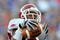 GAINESVILLE, FL - OCTOBER 17: Wide receiver Greg Childs #85 of the Arkansas Razorbacks grabs a pass for a touchdown against the Florida Gators October 17, 2009 at Ben Hill Griffin Stadium in Gainesville, Florida.  (Photo by Al Messerschmidt/Getty Images)