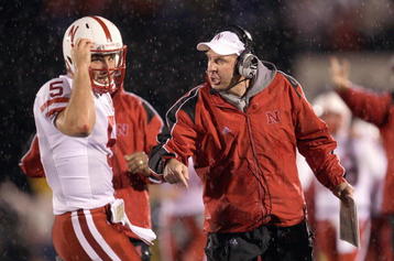 COLUMBIA, MO - OCTOBER 08:  Quarterback Zac Lee #5 of the Nebraska Cornhuskers listens to head coach Bo Pelini during the game against the Missouri Tigers on October 8, 2009 at Faurot Field/Memorial Stadium in Columbia, Missouri. (Photo by Jamie Squire/Getty Images)