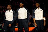 PHOENIX - FEBRUARY 15:  (L-R) Dwyane Wade, LeBron James and Kobe Bryant, members of the women's and men's gold medal winning USA Olympic basketball teams, wave to the crowd during half time of the 58th NBA All-Star Game, part of 2009 NBA All-Star Weekend at US Airways Center on February 15, 2009 in Phoenix, Arizona.  NOTE TO USER: User expressly acknowledges and agrees that, by downloading and or using this photograph, User is consenting to the terms and conditions of the Getty Images License Agreement.  (Photo by Ronald Martinez/Getty Images)