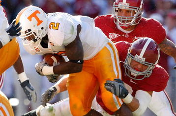 TUSCALOOSA, AL - OCTOBER 24:  Cory Reamer #13 of the Alabama Crimson Tide tackles Montario Hardesty #2 of the Tennessee Volunteers at Bryant-Denny Stadium on October 24, 2009 in Tuscaloosa, Alabama.  (Photo by Kevin C. Cox/Getty Images)