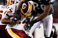 LANDOVER, MD - OCTOBER 26:  Quarterback Jason Campbell #17 of the Washington Redskins avoids a sack by Sean Jones #26 of the Philadelphia Eagles during fourth quarter action at FedEx Field October 26, 2009 in Landover, Maryland. The Eagles won the game 27-17.  (Photo by Win McNamee/Getty Images)