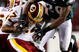 LANDOVER, MD - OCTOBER 26:  Quarterback Jason Campbell #17 of the Washington Redskins avoids a sack by Sean Jones #26 of the Philadelphia Eagles during fourth quarter action at FedEx Field October 26, 2009 in Landover, Maryland. The Eagles won the game 27-17.  (Photo by Win McNamee/Getty Images)