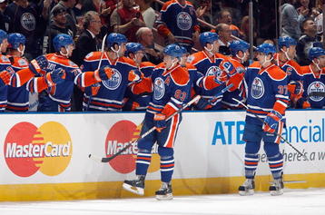 EDMONTON - OCTOBER 12:  Ales Hemsky #83 and Denis Grebeshkov #37 of the Edmonton Oilers greet teammates during the game against the Colorado Avalanche on October 12, 2008 at Rexall Place in Edmonton, Alberta, Canada.  (Photo by Dale MacMillan/Getty Images)