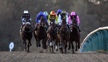LINGFIELD, ENGLAND - OCTOBER 29:  Frankie Dettori has Siroco Breeze (2ndL) handily placed before landing The Coral All-Weather 20TH Anniversary Handicap Stakes Race run at Lingfield Racecourse on October 29, 2009 in Lingfield, England.  (Photo by Simone Joyner/Getty Images)