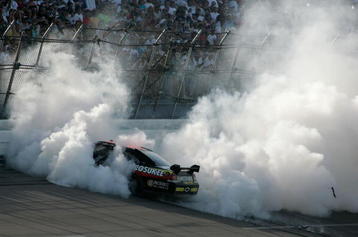 TALLADEGA, AL - APRIL 26:  Brad Keselowski, driver of the #09 Miccosukee Chevrolet, performs a burnout after winning the NASCAR Sprint Cup Series Aaron's 499 at Talladega Superspeedway on April 26, 2009 in Talladega, Alabama.  (Photo by Jerry Markland/Getty Images for NASCAR)