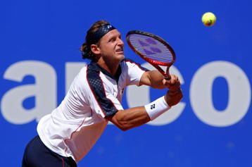BARCELONA, SPAIN - APRIL 23:  David Nalbandian of Argentina returns the ball to Nicolas Almagro of Spain on day four of the ATP 500 World Tour Barcelona Open Banco Sabadell 2009 tennis tournament at the Real Club de Tenis on April 23, 2009 in Barcelona, Spain. Nalbandian won the match in two sets, 6-3 and 6-4.  (Photo by Jasper Juinen/Getty Images)