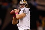 NEW ORLEANS - OCTOBER 04:  Quarterback Drew Brees #9 of the New Orleans Saints warms up during pregame wearing pink shoes to support Breast Cancer Awareness before playing the New York Jets at the Louisana Superdome on October 4, 2009 in New Orleans, Louisiana.  (Photo by Chris Graythen/Getty Images)