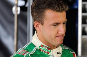 MARTINSVILLE, VA - OCTOBER 23: AJ Allmendinger, driver of the #44 Coleman Natural Foods Dodge, looks on in the garage prior to practice for the NASCAR Sprint Cup Series TUMS Fast Relief 500 at Martinsville Speedway on October 23, 2009 in Martinsville, Virginia.  (Photo by Rusty Jarrett/Getty Images for NASCAR)