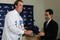 LOS ANGELES - JANUARY 12: Right handed pitcher Derek Lowe (L) receives a hat from General Manager Paul DePodesta during a press conference after signing a four-year contract with the Los Angeles Dodgers January 12, 2005 at Dodger Stadium in Los Angeles, California. (Photo by Jeff Gross/Getty Images)