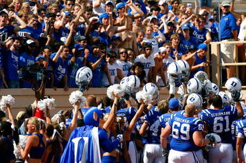 DURHAM, NC - SEPTEMBER 13:  The Duke Blue Devils celebrate with fans after defeating the Navy Midshipmen 41-31 during the game at Wallace Wade Stadium on September 13, 2008 in Durham, North Carolina.  (Photo by Kevin C. Cox/Getty Images)