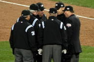 NEW YORK - OCTOBER 28:  The Umpire crew dicuss a call on a ball hit by Robinson Cano #24 (2nd R) of the New York Yankees as Cano and first base coach Mick Kelleher #50 looks on in the bottom of the fifth inning against the of the Philadelphia Phillies in Game One of the 2009 MLB World Series at Yankee Stadium on October 28, 2009 in the Bronx borough of New York City.  (Photo by Nick Laham/Getty Images)